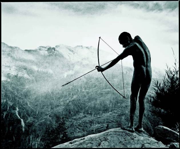&copy; Chris Rainier. Young Boy playing at initiation ritual, Angguruk, Irian Jaya.