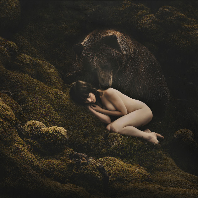 Brave in her vulnerability. Shot
in the middle of moss-covered
lava in Iceland. &copy; Emma McEvoy.