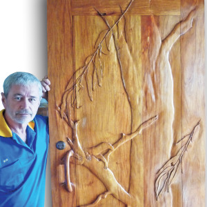 Inspired by nature, Robert McGregor carved an entrance door for his house.