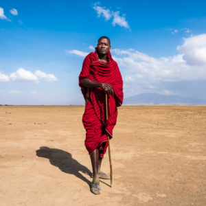 <i>Don&rsquo;t be scared to try different angles! This Maasai warrior image was made at knee level to make him look taller and with a view to illustrating the expansive area he calls home. Aperture Priority, 24-120mm lens @ 24mm, 1/1500s @ f/8, ISO 400.</i>