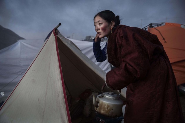 Daily Life, 2nd prize stories. Kevin Frayer, Canada, 2015, Getty Images. Tibetan Buddhist nomads cook by candlelight in Sertar county, Garze Tibetan
Autonomous Prefecture, Sichuan province, China, 31 October 2015.
