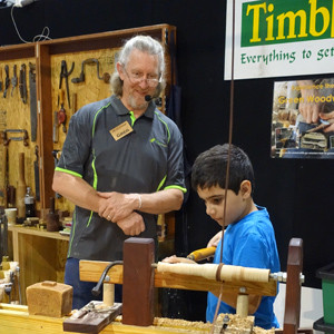 Charbel Chalhoub, 9, keen student of pole lathe turning, under Greg Miller&rsquo;s watchful eye.