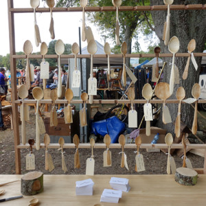 Viewing the Lost Trades Fair 2016 through a screen of spoons displayed by Peter Trott, aka Von Trott.