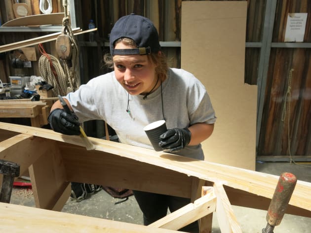 Student Miriam Taal &ndash; preparing for the fitting of the next plank with glue.