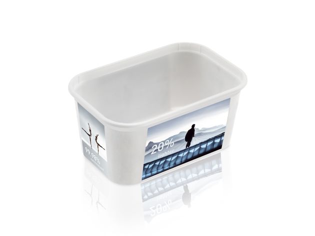 This in-mould-labelled cup, the production of which will be demonstrated live at K, weighs only 10.7 g thanks to injection compression moulding (image: Netstal).