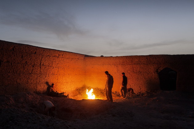 US Marines stand near the burn pit at Patrol Base Beatley, in Marja District, Helmand Province, Afghanistan, on April 20, 2010. US Marines entered Marja District in Helmand Province, Southern Afghanistan in February 2010 as part of the largest joint operation by NATO and Afghan forces to be conducted in the US-led occupation to that point.