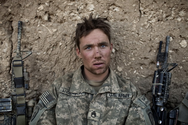 US Army Sergeant Anderson sits at a temporary patrol base after a patrol in the Tangi Valley, Wardak Province, Afghanistan, on September 11, 2009. Australian Adam Ferguson's images from wars in Iraq and Afghanistan were some of the finest documentary images we saw this year. &copy; Adam Ferguson