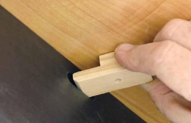 Fitting a table button.