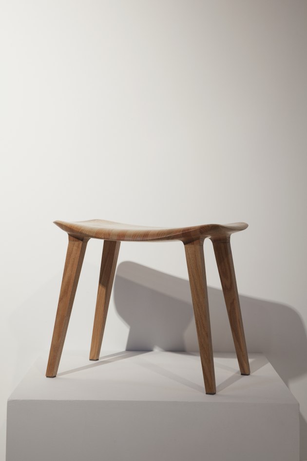 Flow Stool by Jacques Cronje: The Flow Stool is conceived as an intersection of two forms. From below, the angular supporting structure, akin to columns holding up a bridge, with their straight lines and flat surfaces blending into the structure. From above, the human form, softly curved to create an inviting seat. It is at the intersection of these two that the Flow Stool makes its sculptural statement, where it expresses the juxtaposition of human softness and structural rigidity in an undulating flowing edge.