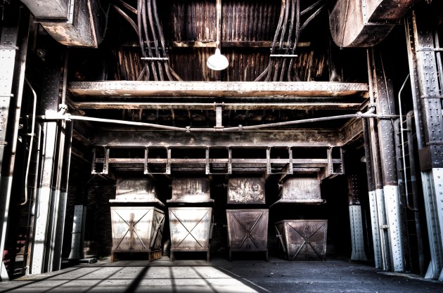 Hopper bins. Maybe, the waste capture of the burnt coal slag/soot or whatever. I think maybe those rows of the top middle are pipes of water that extend up several levels. I was lucky to be there to catch the morning sun come straight through the massive window behind me. &copy; Brett Patman