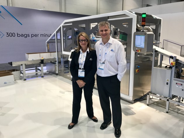 Tna's co-founder Nadia Taylor and Group GM Michael Green with the new ropac 5 high speed case packer in the VIP booth.