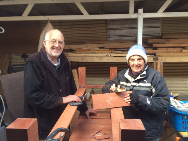 Ballarat Woodworkers Guild members Maurie Trainor and Sharon Paulson crafting a redwood workbench.