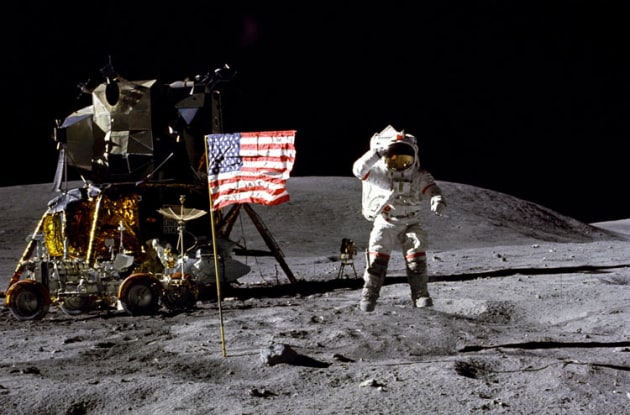 John Young leaps in the air as he salutes the US flag on the moon during the Apollo 16 mission in April 1972. The lunar module Orion and the lunar rover can be seen in the background. (NASA)