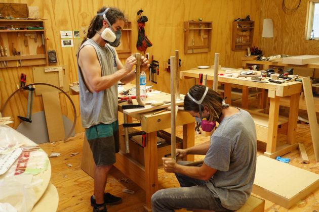 All hands on deck. Josh Knox and Ted Synnott join forces to finish a chair frame.