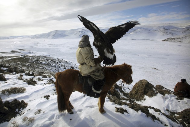 Kazakh Golden Eagle hunter on horseback. &copy; Timothy Allen/Getty Images