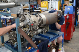 An engineer works on a turbine engine at a maintenance, repair and overhaul (MRO) base. (Steve Hitchen)