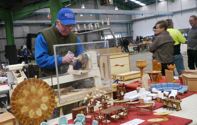 Ray Hill, Ballarat Woodworkers Guild member is an expert at miniatures, furniture and small fine turnings. Some of his work is can be seen on the table in front of him.