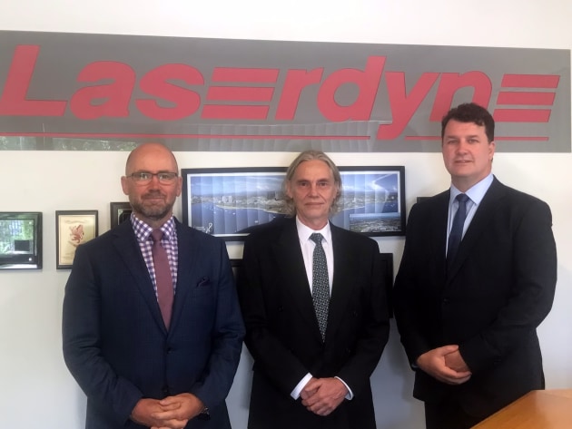 Tony Vonthoff from Saab Australia, Tom White from LaserDYNE and Adam Watson from BAE Systems at partnership agreement signing at Laserdyne in Queensland. Credit: Saab Australia