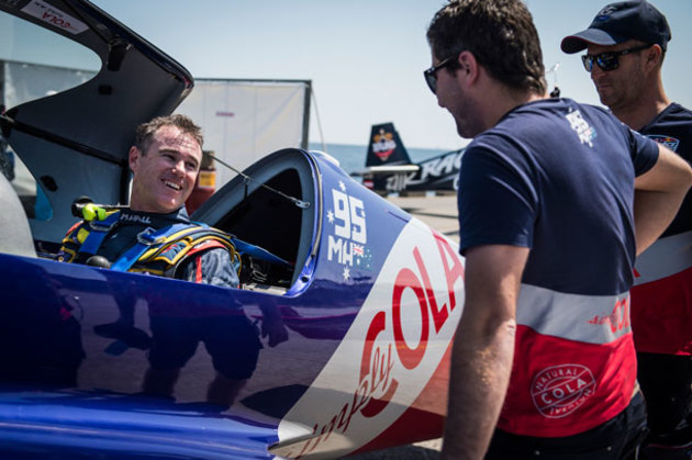Matt Hall chats to his crew after a training session for the 2016 Red Bull Air Race World Championship round in Chiba, Japan. (Red Bull Content Pool/Jason Harayko