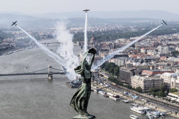 Red Bull pilots Peter Besenyei, Yoshi Muroya and Petr Kopfstein arc high over the Danube ahead of the 2017 Red Bull Air Race at Budapest, Hungary. (Red Bull Content Pool/Joerg Mitter)