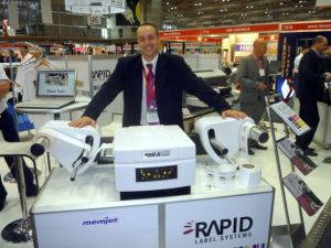 Rapid Australia's Nick Mansell with the locally developed RapidX press at this year's PacPrint13 show in Melbourne.