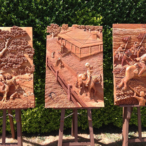 Richard Yates recently completed triptych &lsquo;Lad to Light Horse&rsquo; is deep relief carved from cypress.