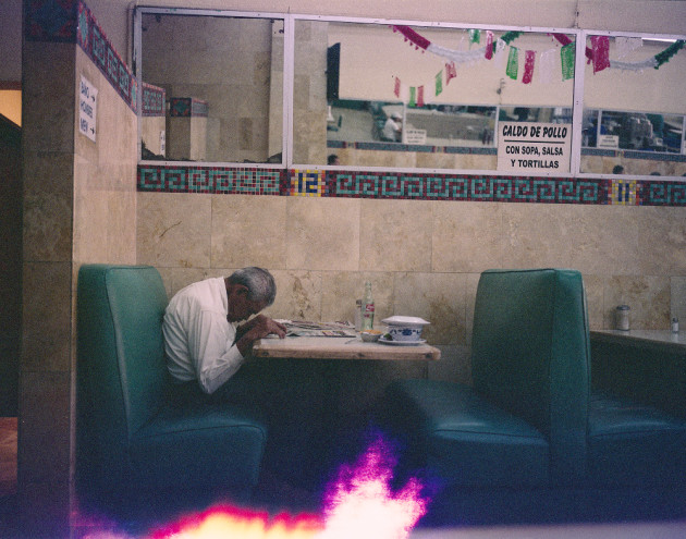 Diner in Juarez, Mexico, 2012. The Lost Rolls Project. &copy; Ron Haviv.