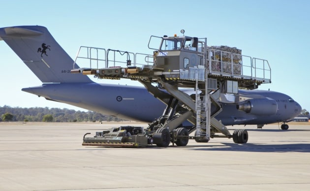 An aircraft scissor lift cargo loader supports a RAAF C-17 Globemaster III. Credit: Defence