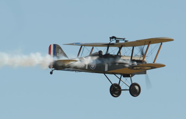 Our hero is in trouble! The Australian Vintage Aviation Society (TAVAS) SE5a trails smoke after a mock dogfight with a Fokker Triplane. (Steve Hitchen)