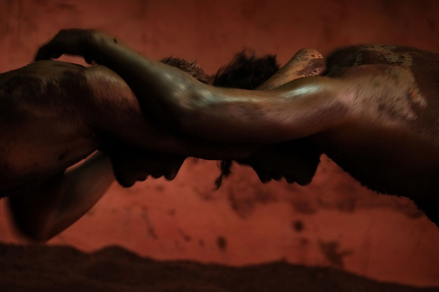&copy; Alain Schroeder, Belgium. WINNER, TRAVEL PHOTOGRAPHER OF THE YEAR 2017. Kolhapur, Maharashtra State, India. Kushti is the traditional form of Indian wrestling. Practiced in an Akhara, the wrestlers, under the supervision of a guru, dedicate their bodies and minds to Kushti on average for 6 to 36 months.