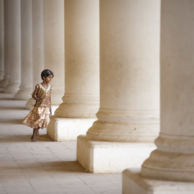 &copy; Paul Sansome, UK. WINNER, CELEBRATION OF HUMANITY PORTFOLIO. Madurai, Tamil Nadu, India.  A young girl plays in Thirumalai Nayak Palace in Madurai.