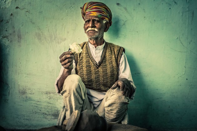 The Potter
We stopped in a local village outside Udaipur, in India. There was basically one person for each task or manual requirement, apart from tailors. There were lots of tailors. So one chaiwala, mustard oil man, baker, milk seller, chilli seller... and this fine man was the potter! He made the water vessels for the village. They were beautiful. I am in his potting shed with him for this image. The sense of relaxed industry was very cool. He didn't have a potting wheel but would spin the clay by hand and smack the clay as he did with a wooden paddle. We were surrounded by about 100 children when I took this photograph.