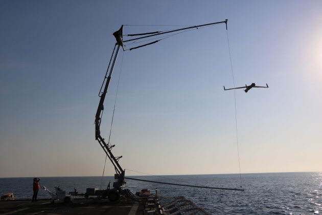A US Coast Guard vessel prepares to recover a Insitu Pacific ScanEagle. Credit: Boeing