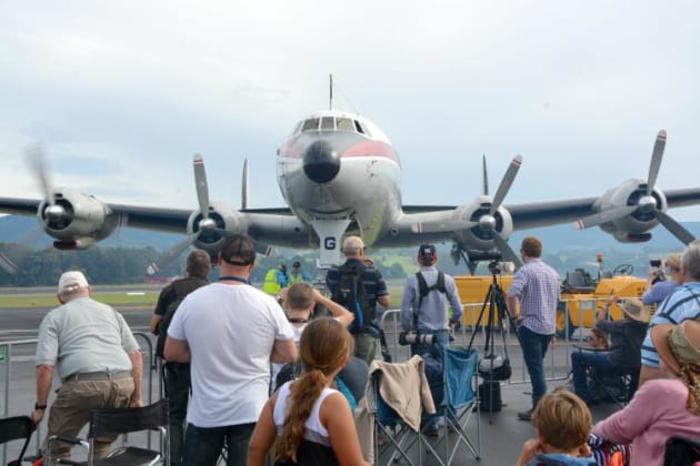 The crowd watches an engine start on the HARS Super Constellation at WOI 2016. (Steve Hitchen)