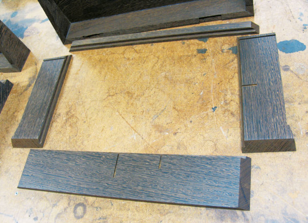 Parts for the box bottoms just prior to assembly with glue, showing the grooves pre-cut for the internal partitions.