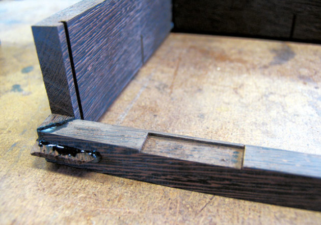 Close-up of the feather splines glued into the back corners of the box bottom.