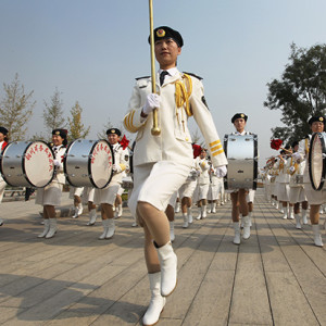 As you hone your instinct for a photograph, your images will exhibit a sharper focus on key moments. Here I jumped in front of a marching band seconds before they moved off in formation.