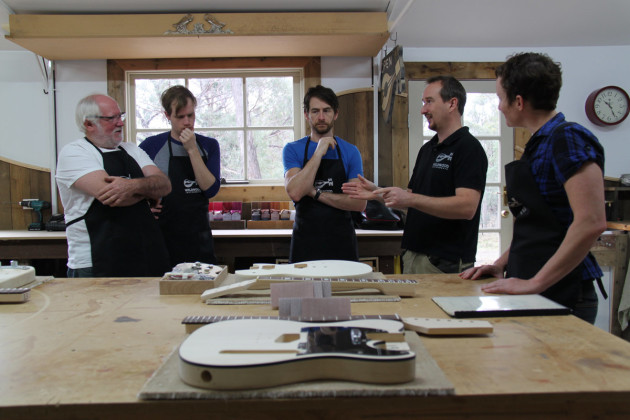 Electric guitar making workshop in progress with tutor Nick Carpenter (second from the right).
