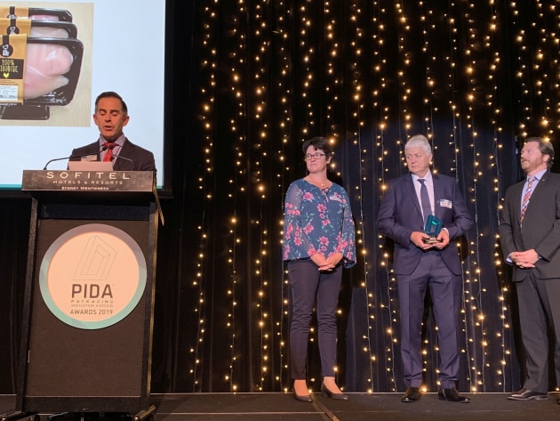 MC Anthony Peyton reads the citation for the gold award winner in the PIDA 2019 Save Food Packaging Design award, which went to Hazeldene's Chicken Farm & Sealed Air for Cryovac Darfresh on Tray vacuum skin technology.