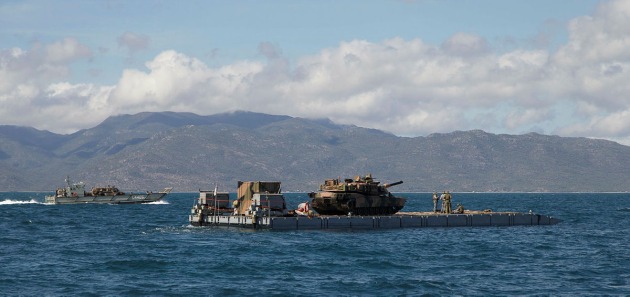 HMAS Choules' MEXEFLOTE landing raft transports an Abrams M1A1 main battle tank during Exercise Talisman Saber. Credit: Defence