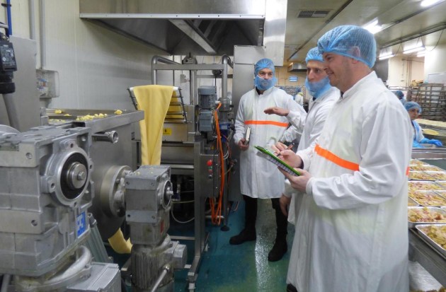 RMR Engineers Jeremy Irwin (left) and Tristan Hoy (right) review a client&rsquo;s (centre) existing facility for process upgrades and expansion planning.