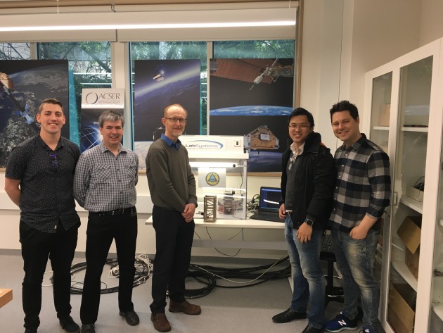 Benjamin Southwell, Dr Eamonn Glennon, Prof Andrew Dempster, Dr Joon Wayn Cheong, and Dr William Crowe with a model of the cubesat in the ACSER lab, UNSW Sydney.
Ewen Levick