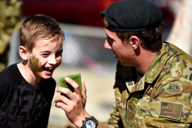 Members of the ADF at a local community event in Bowen, Queensland. 480,000 Queenslanders have a connection to Defence. 
Defence