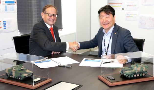 Adrian Smith, Managing Director of K-TIG, and Richard Cho, Managing Director of Hanwha Defense Australia, signing a Memorandum of Understanding recently. (Credit: Hanwha Defense)