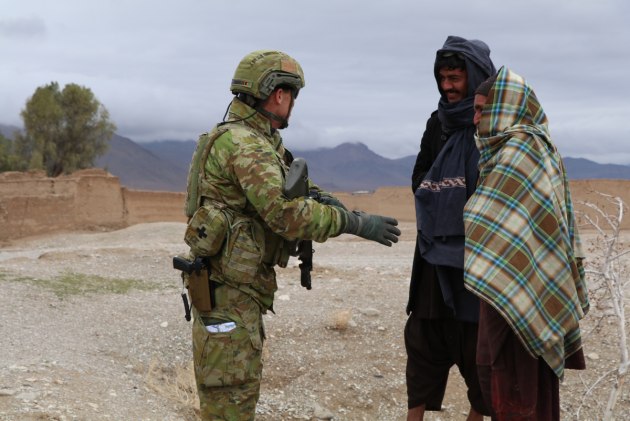 Brigadier John Shanahan speaks with Afghan people in Ghorak, Afghanistan.
Defence