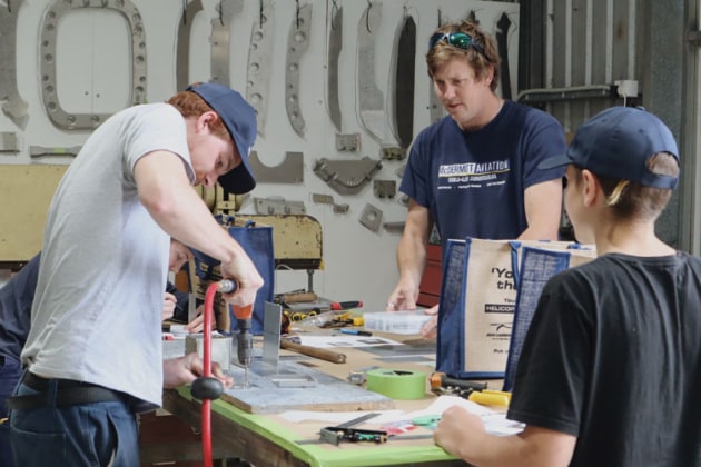 Aspiring helicopter engineers attend a workshop at McDermott Aviation in Queensland. (Australian Helicopter Industry Future Foundation)