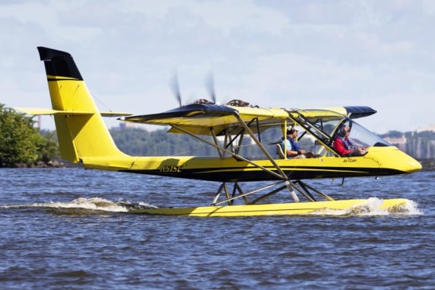 A Lockwood AirCam twin pusher floatplane taxis on the lake. (Philip Hosking)