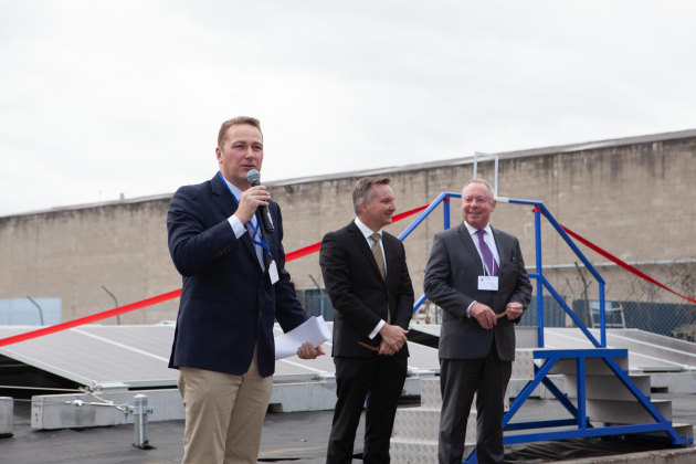 Aleks Lajovic, MD of Impact International, speaking at the solar farm launch. To his right, the Hon Chris Bowen MP and the Hon Dr. Hugh McDermott MP look on.  Image:  Smart Commercial Solar