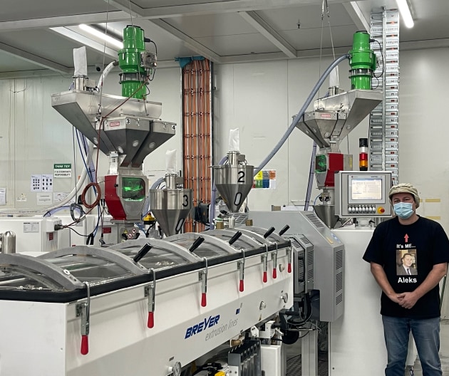 Aleks Lajovic, MD Impact International, alongside the new Breyer extrusion line installed at the company's Smithfield facility this month.