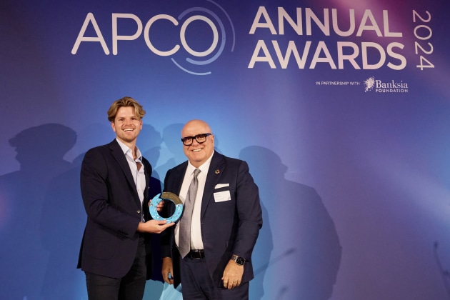 Alex Adda picks up the Recyled Content Award from APCO board director Trent Bartlett.